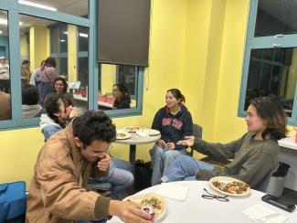 Attendees conversed over food that included a selection of tacos, sides and pies. Iris Guo / Daily Nexus