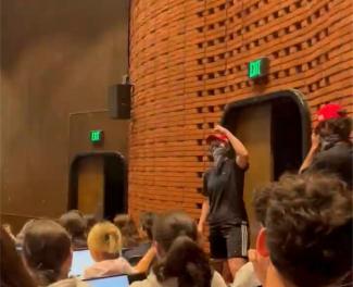Four students masked in bandanas and donning MAGA hats entered the class yelling in protest of the presence of immigrants and LGBTQIA+ people on campus. Courtesy of YikYak